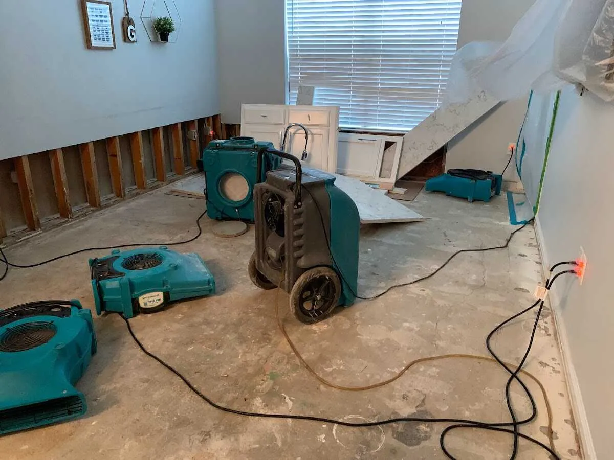 Dehumidifier in flood-cut room for Water Damage Restoration in Milliken